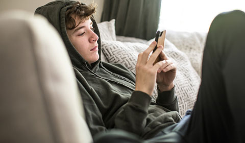 Young person browsing mental health websites on phone